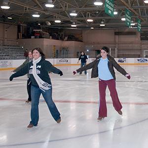 People skating in Bird Ice Arena